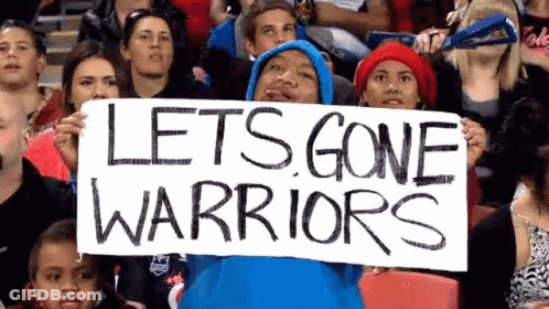 A Man In A Blue Hoodie Is Holding A Sign That Says Let 'S Gone Warriors GIF