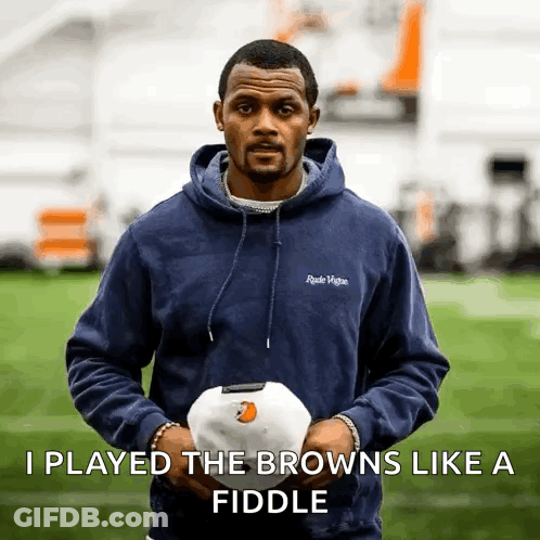 A Man In A Blue Hoodie Is Holding A White Ball With The Words I Played The Browns Like A Fiddle Below Him GIF