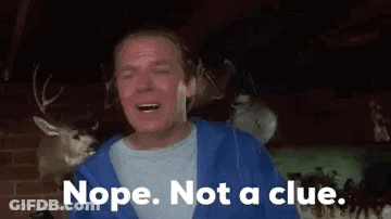A Man In A Blue Hoodie Is Standing In Front Of A Deer Head And Says Nope . Not A Clue GIF