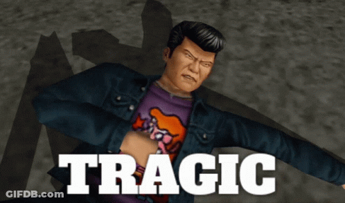 A Man In A Blue Jacket And A Purple Shirt With The Word Tragic On It GIF