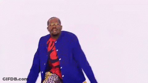 A Man In A Blue Jacket And Red Shirt Is Dancing . GIF