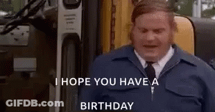 A Man In A Blue Jacket And Tie Is Standing In Front Of A Bus . GIF