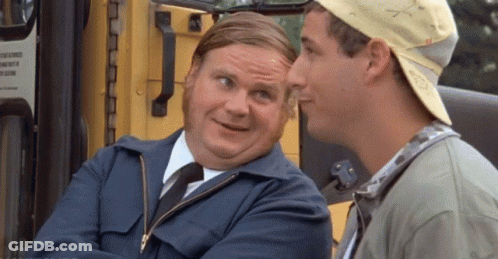 A Man In A Blue Jacket And Tie Is Talking To Another Man In A Baseball Cap . GIF