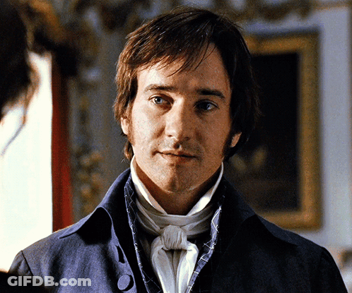 A Man In A Blue Jacket And White Tie GIF