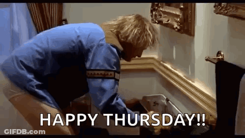 A Man In A Blue Jacket Is Cleaning A Trash Can In A Bathroom With The Words `` Happy Thursday ! '' GIF