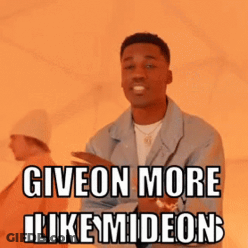 A Man In A Blue Jacket Is Giving A Thumbs Up And Says Give On More Likemideon GIF