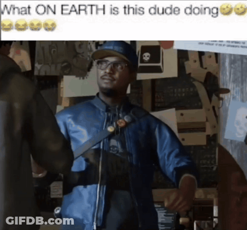 A Man In A Blue Jacket Is Standing In Front Of A Wall With Papers On It And A Caption That Says What On Earth Is GIF