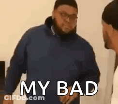 A Man In A Blue Jacket Is Standing Next To Another Man In A White Shirt And Talking To Him . GIF