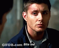 A Man In A Blue Jacket Is Talking To Another Man And Says `` Bite Me '' . GIF