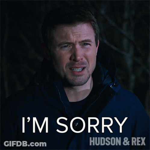 A Man In A Blue Jacket Says " I 'M Sorry " GIF
