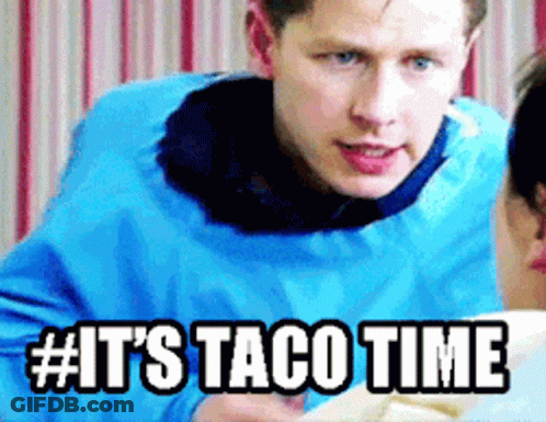 A Man In A Blue Jacket Says It 'S Taco Time While Talking To A Woman GIF