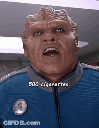 A Man In A Blue Jacket With The Words 500 Cigarettes Written Below Him GIF