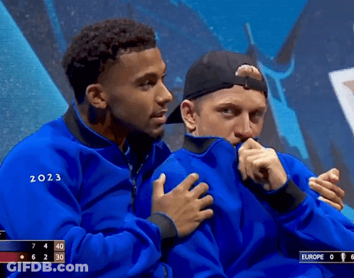 A Man In A Blue Jacket With The Year 2023 On It GIF
