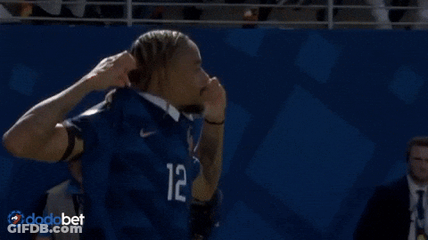 A Man In A Blue Jersey With The Number 12 On It GIF