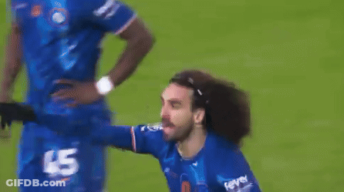 A Man In A Blue Jersey With The Number 45 On It Is Standing On A Soccer Field . GIF