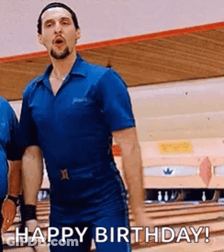 A Man In A Blue Jumpsuit Is Standing In A Bowling Alley And Says `` Happy Birthday '' . GIF