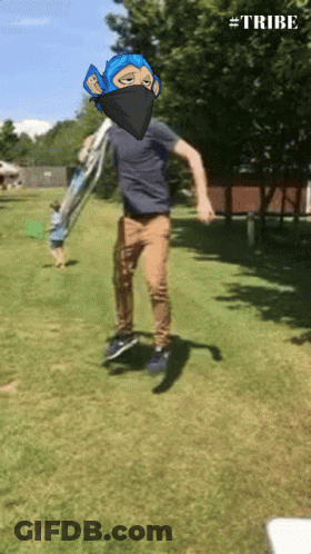 A Man In A Blue Mask Is Jumping In The Air With The Hashtag #Tribe Visible GIF