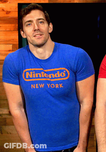 A Man In A Blue Nintendo New York Shirt GIF