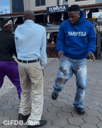 A Man In A Blue Paripesa Sweatshirt Dancing GIF
