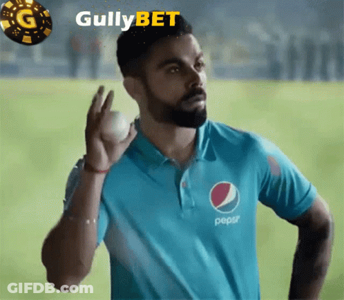 A Man In A Blue Pepsi Shirt Is Holding A Ball GIF