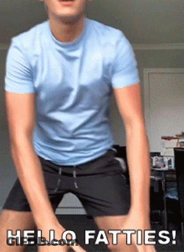 A Man In A Blue Shirt And Black Shorts Is Dancing With The Words Hello Fatties Below Him GIF