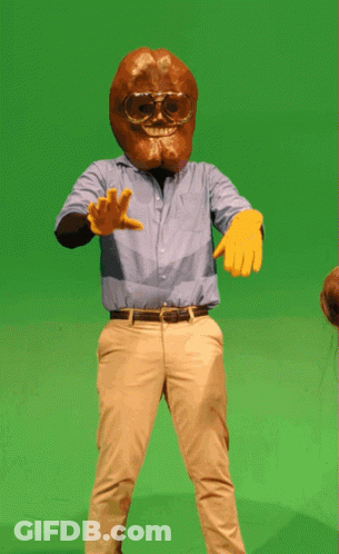 A Man In A Blue Shirt And Khaki Pants Is Wearing A Mask And Goggles GIF