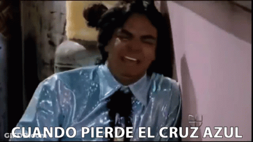 A Man In A Blue Shirt And Tie Is Crying With The Words Cuando Pierde El Cruz Azul Below Him GIF