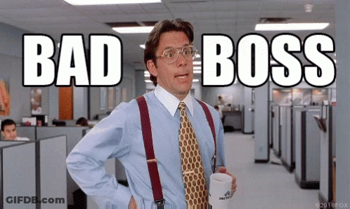 A Man In A Blue Shirt And Tie Is Holding A Cup Of Coffee And Says " Bad Boss " GIF