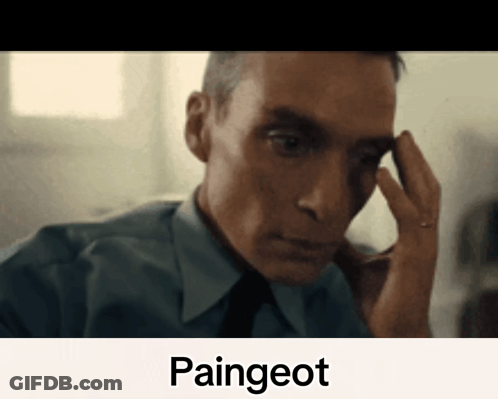 A Man In A Blue Shirt And Tie Is Holding His Hand To His Forehead With The Word Paingeot Written Below Him GIF
