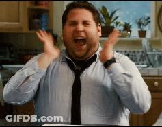 A Man In A Blue Shirt And Tie Is Making A Surprised Face GIF