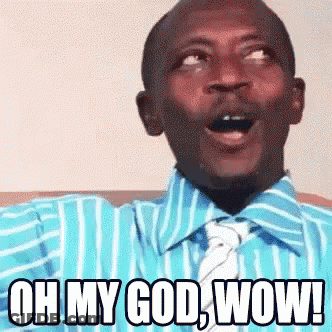 A Man In A Blue Shirt And Tie Is Saying Oh My God Wow . GIF