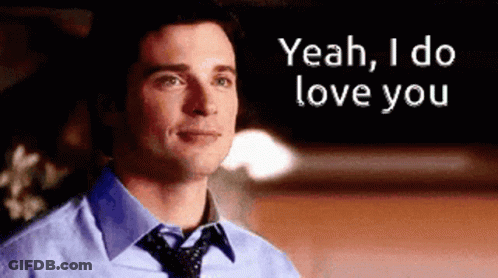 A Man In A Blue Shirt And Tie Is Saying " Yeah I Do Love You " GIF