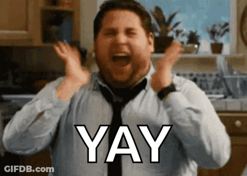 A Man In A Blue Shirt And Tie Is Screaming With The Word Yay Above His Head GIF