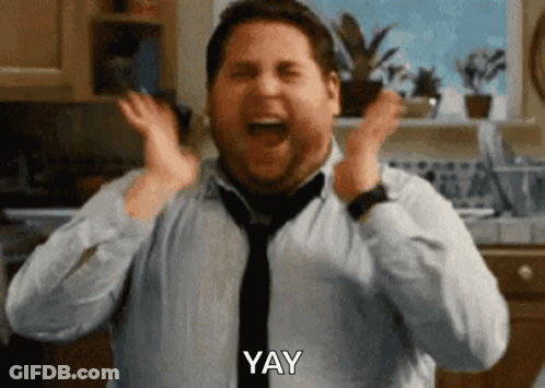 A Man In A Blue Shirt And Tie Is Screaming With The Word Yay Written Below Him GIF
