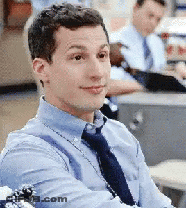 Man In Blue Shirt And Tie At Office Desk GIF