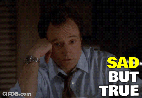 A Man In A Blue Shirt And Tie Is Sitting At A Desk With The Words Sad But True Above Him GIF
