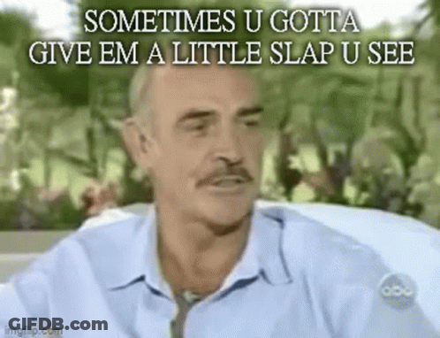 A Man In A Blue Shirt And Tie Is Sitting In A Car And Talking . GIF