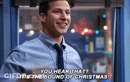 A Man In A Blue Shirt And Tie Is Talking About Christmas . GIF