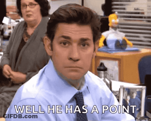 A Man In A Blue Shirt And Tie Says Well He Has A Point In Front Of Him GIF