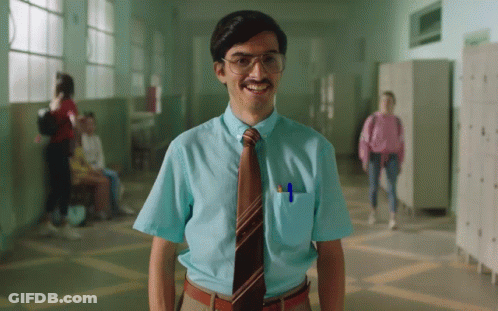 A Man In A Blue Shirt And Tie With A Pen In His Pocket GIF