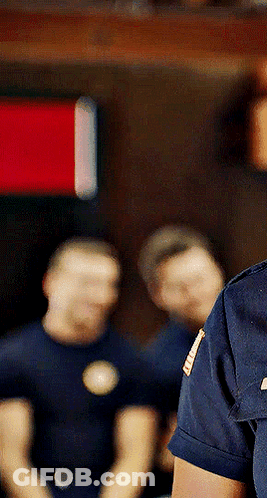 A Man In A Blue Shirt Has A Badge On His Shoulder That Says ' U.s. Army ' GIF