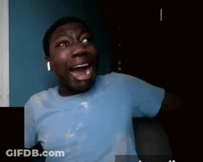 A Man In A Blue Shirt Has His Mouth Open GIF