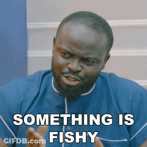 A Man In A Blue Shirt Has Something Fishy Written On His Face GIF