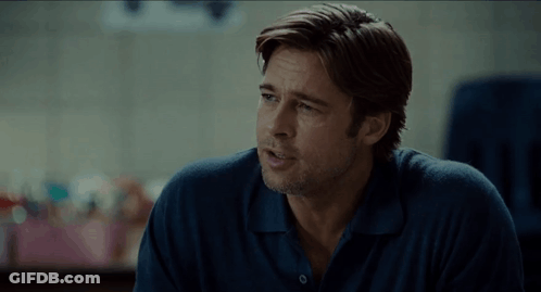 A Man In A Blue Shirt Has The Word What Written On The Screen GIF