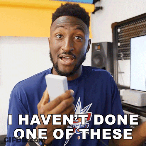 A Man In A Blue Shirt Holds A Cell Phone And Says I Haven 'T Done One Of These GIF