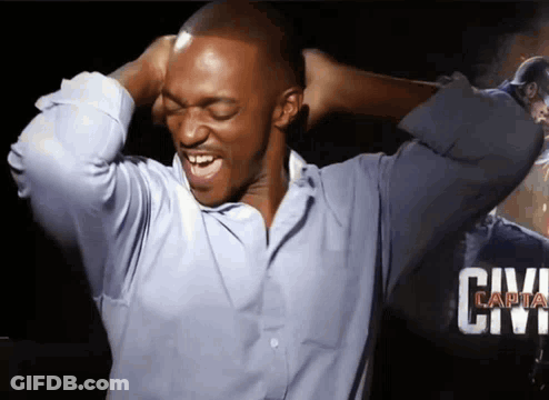 A Man In A Blue Shirt Is Covering His Ears With His Hands And The Word Civil Is Visible In The Background GIF