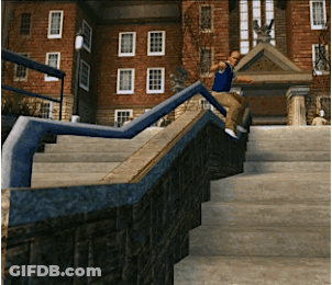 A Man In A Blue Shirt Is Doing A Trick On A Railing GIF