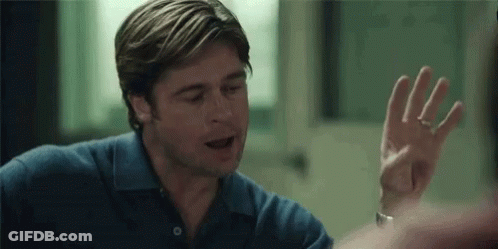 A Man In A Blue Shirt Is Giving A High Five To Someone . GIF