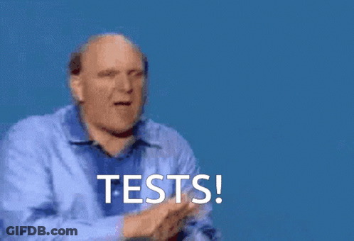A Man In A Blue Shirt Is Giving A High Five With The Words Tests Written Below Him GIF