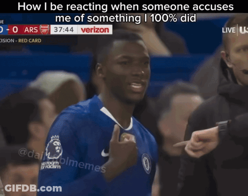 A Man In A Blue Shirt Is Giving A Thumbs Up In Front Of A Verizon Sign GIF